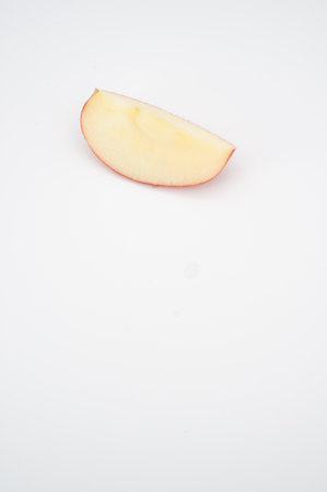 isolated fresh and tasty bio organic apple slice on white background with copy space