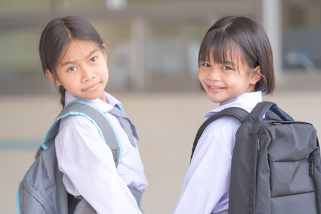 Portrait of children student in uniform and backpack Looking at camera going back to school after...