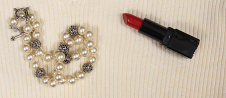 Pearls and Red Lipstick on White Sweater Closeupの写真素材