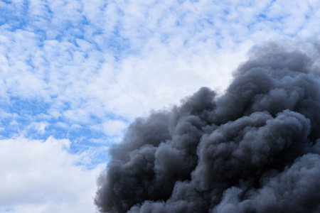 Fire smoke from burning industrial buildingの写真素材