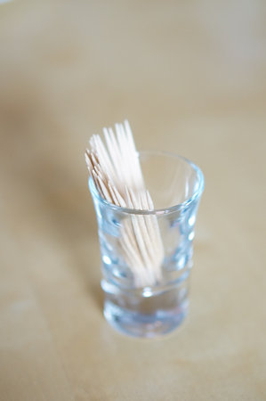 Group of wooden toothpicks in a glassの写真素材