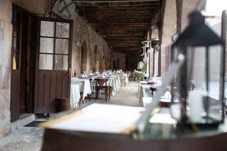 A row of serviced tables row in a cafe terraceのeditorial素材