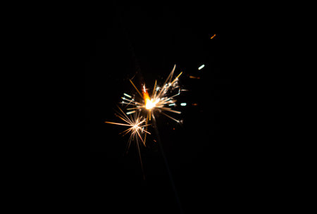 Lights of a sparkler with black background