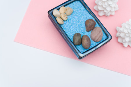 isolated terracotta vases with decorative sand and pebbles with space for textの写真素材