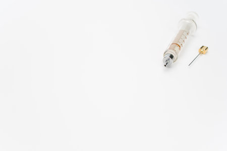 an isolated injection syringe on white paper background with text spaceの写真素材