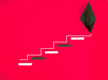 Wooden block stacking as step stair with black paper ship on red background, Ladder of success in business growth concept, copy spaceの写真素材