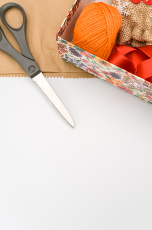 paperboard flower decorated box on white background with text space and stationeryの写真素材