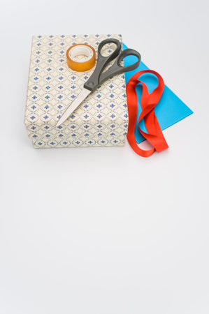 a closed white paperboard decorated box on white background with text spaceの写真素材