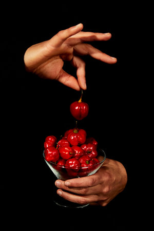 Hands holding red hot chili habanero peppers. Spicy, cuisine and mexican concept.の写真素材