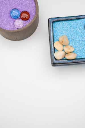 isolated terracotta vases with decorative sand and pebbles with space for text