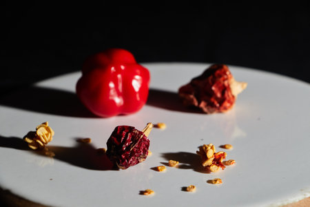 Red chilli peppers on black background