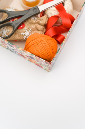 paperboard flower decorated box on white background with text space and stationeryの写真素材