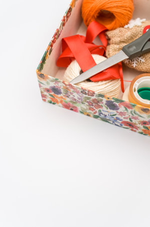 paperboard flower decorated box on white background with text space and stationeryの写真素材