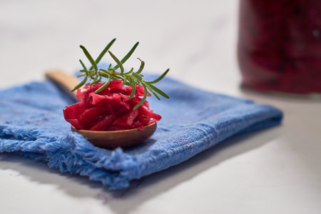 Red cabbage sauerkraut on wooden spoon.の写真素材