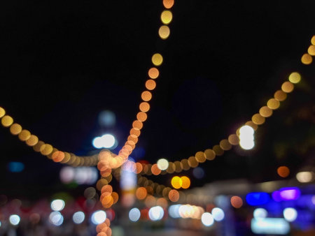 Christmas light blur background - light bokeh from Xmas decoration on pole at night party in winter. vintage retro color style.の写真素材