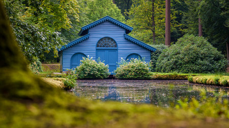 This photo was taken in the royal park of 't Loo Palace near Apeldoorn in the Netherlands. This is a Boathouse that was used by three generations of queens. it was built in the late 18th century by the royal family.のeditorial素材