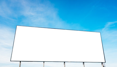 Mockup white poster or white paper promotion displayed on a blue sky backgroundの写真素材