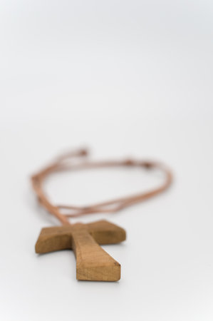isolated hand carved solid wood greek letter tau  pendant with space for text