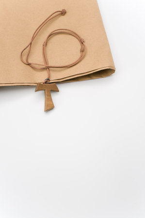 isolated hand carved solid wood greek letter tau  pendant with space for textの写真素材