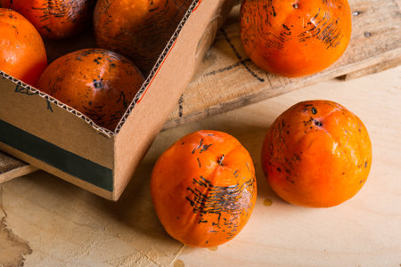 Juicy tropical persimmon fruitsの写真素材