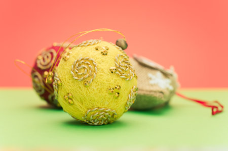 Christmas time decorations with sapce for text on a green red paper surfaceの写真素材