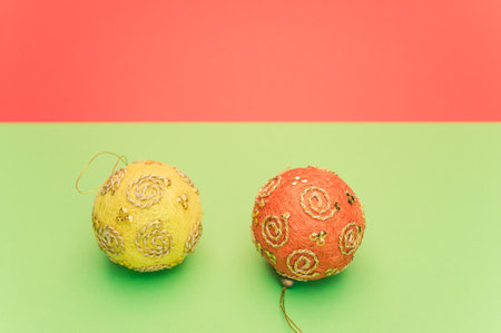 Christmas time decorations with sapce for text on a green red paper surfaceの写真素材