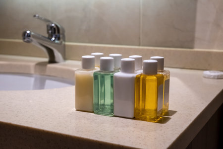 small cleaning bottles in hotel bathroomの写真素材