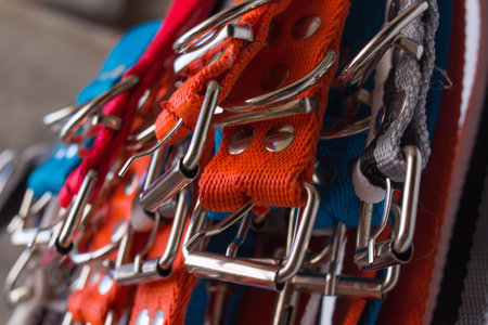 detail of buckles of collars for pets of various colors in a factory - macroの写真素材