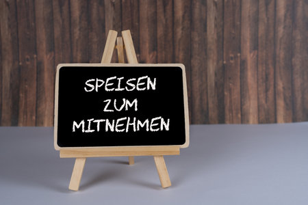 Food delivery, blackboard with the German words for takeaway foodの写真素材