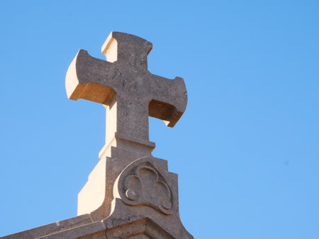 Nice photo of a religious cross in stone with a view from belowの写真素材