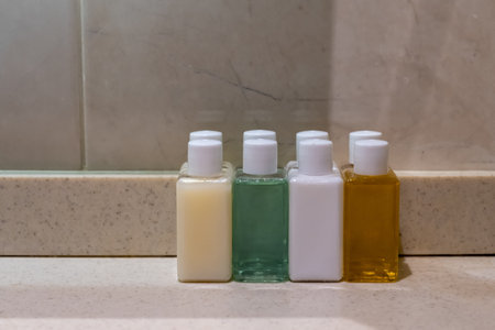 small cleaning bottles in hotel bathroomの写真素材