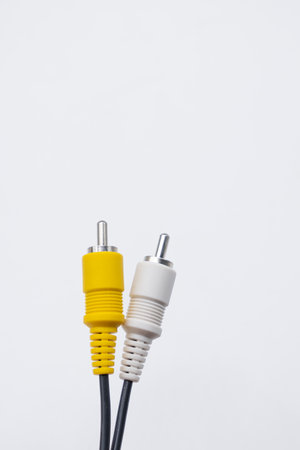 yellow and white Cable. Audio video cable RCA jack isolated on white backgroundの写真素材
