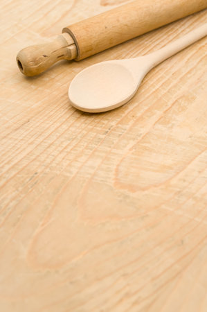 top view of wooden kitchen utensils on a wooden background with copy spaceの写真素材