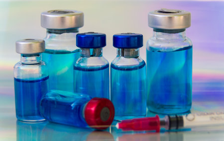 close up group of vaccine vials and syringeの写真素材
