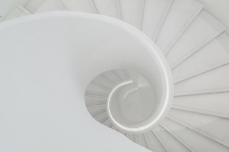 spiral grey white staircase with large copy space