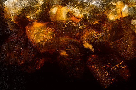 Cola in glass with clear ice cubesの写真素材