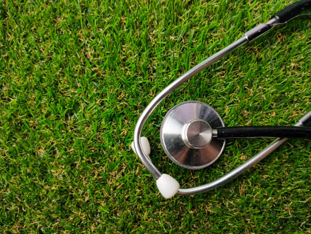Stethoscope on a green grass with copy space.の写真素材
