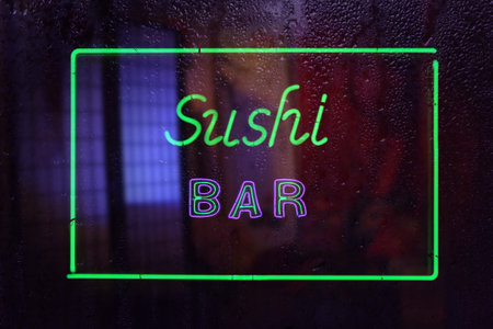 Vintage Neon Sushi Bar Sign in Wet Window