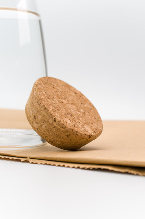 glass flask filled with pure clean water on a white and food paper background with text spaceの写真素材