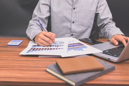 Business people sit at work and check documents At the desk in the room