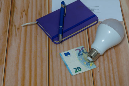 light bulb and money energy saving concept, electricity billの写真素材