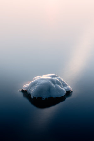 Long exposure image of frozen rocks by a calm seaの写真素材