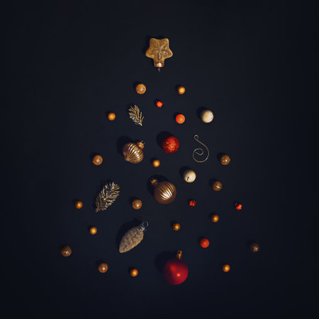 Merry Christmas and happy new year concept. Christmas tree made of colorful ornaments and balls on black background. The original idea for seasonal holidays. Festive holiday art. Ornaments concept.の写真素材