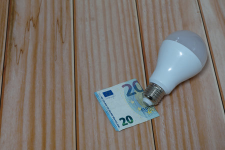 light bulb and money energy saving concept, electricity billの写真素材