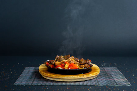Fajitas dish on isolated black backgroundの写真素材