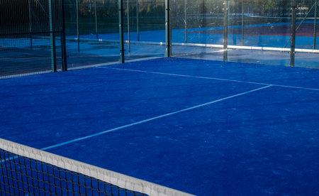 Partial view of a blue paddle tennis courtの写真素材