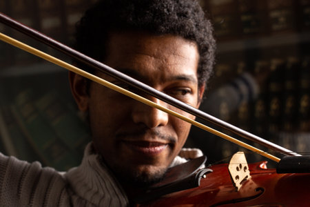 Closeup of man playing violin