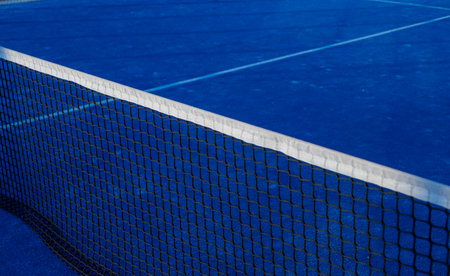 Partial view of a blue paddle tennis courtの写真素材