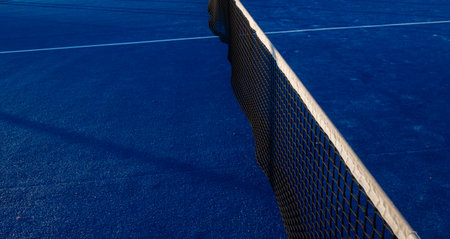 Partial view of a blue paddle tennis courtの写真素材