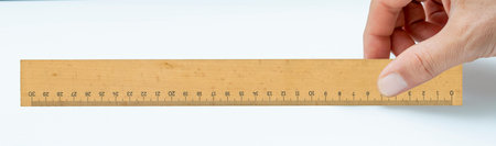 Hand holding  pitted dates isolated on white backgroundの写真素材